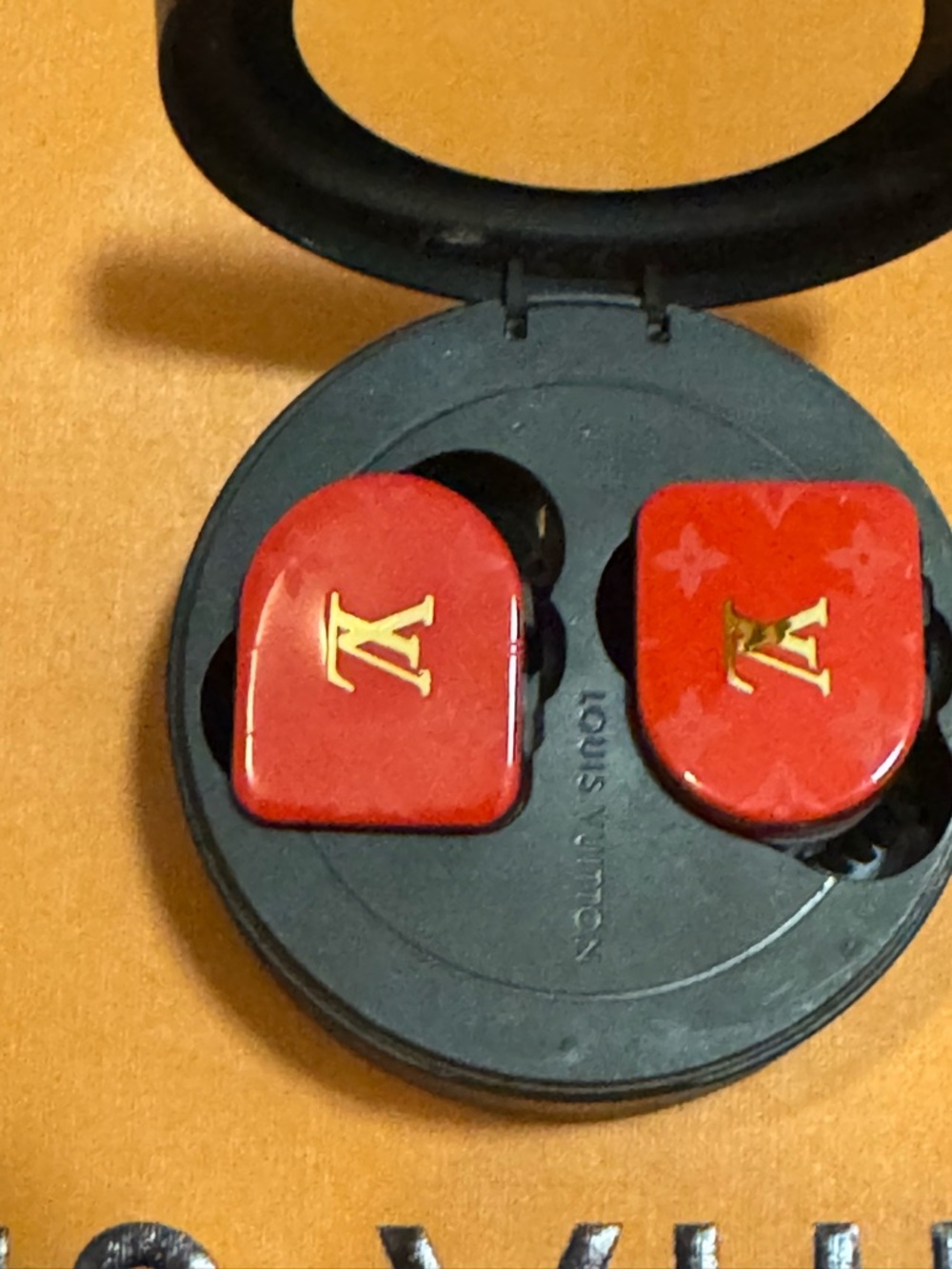 Louis Vuitton Red Earbuds with Gold LV Emblems